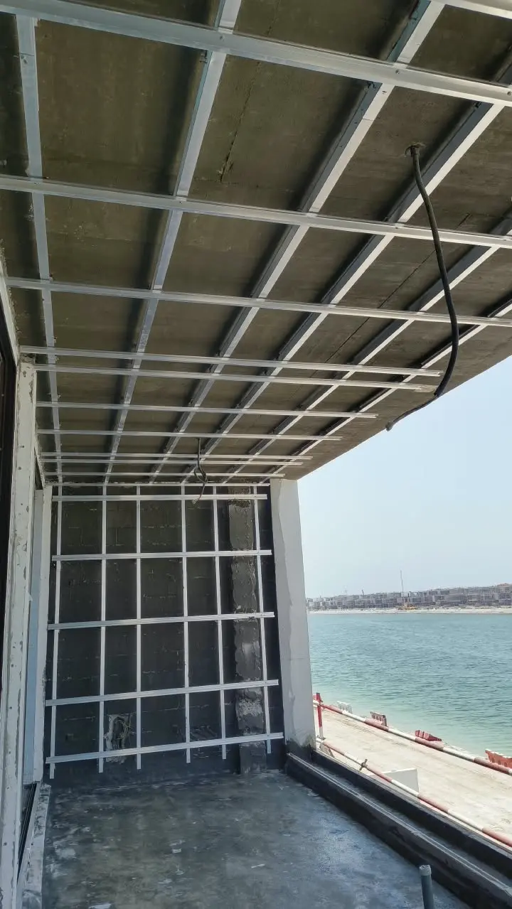 Close view of HPL ceiling subframe beside a waterfront terrace